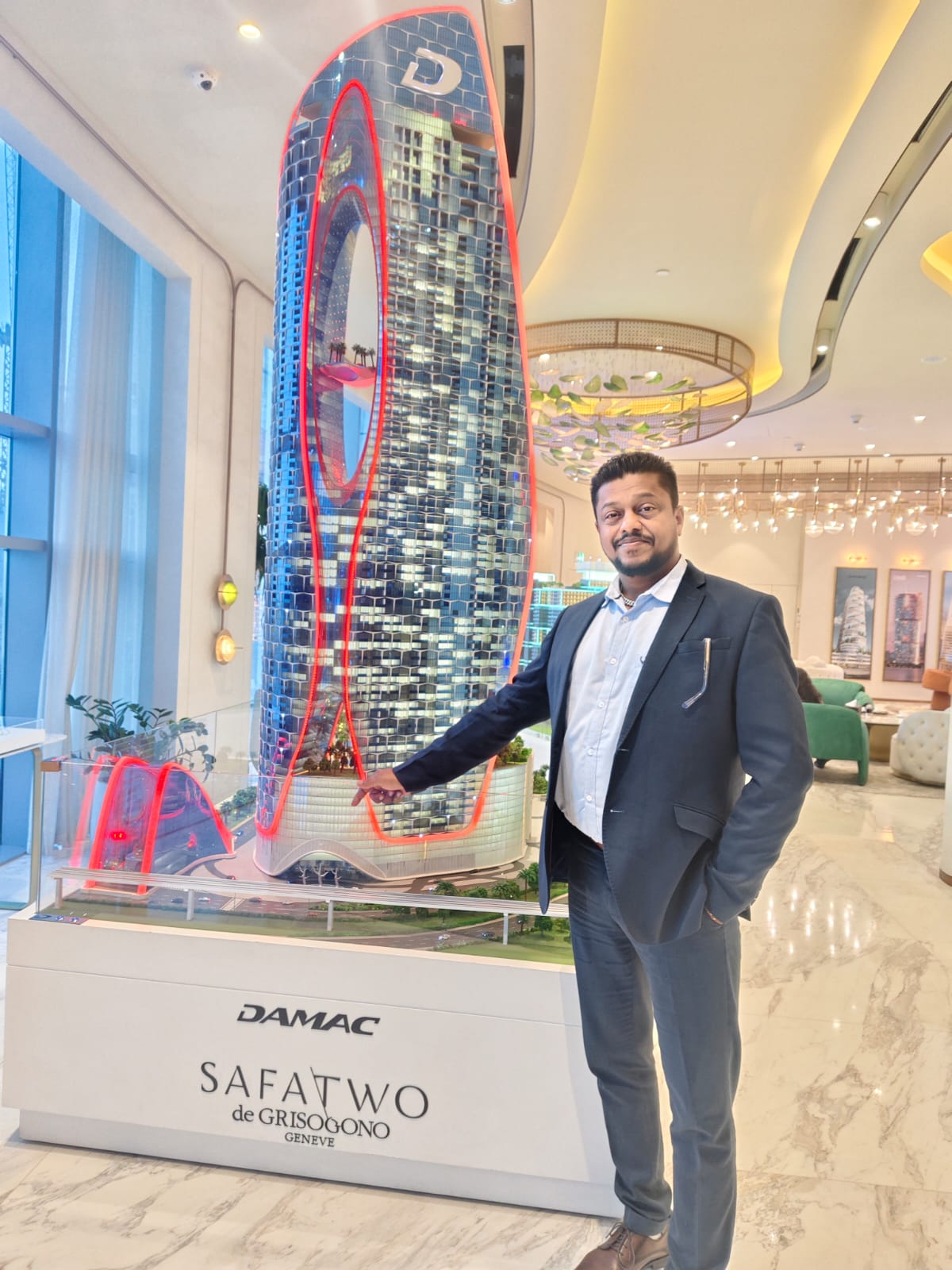 Sandeep Kumar studying a DAMAC Safa Two tower model