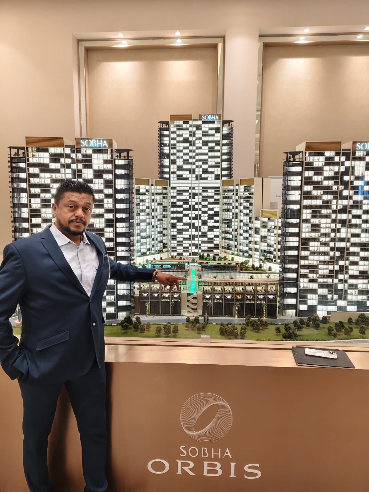 Sandeep Kumar examining the Sobha Orbis project model
